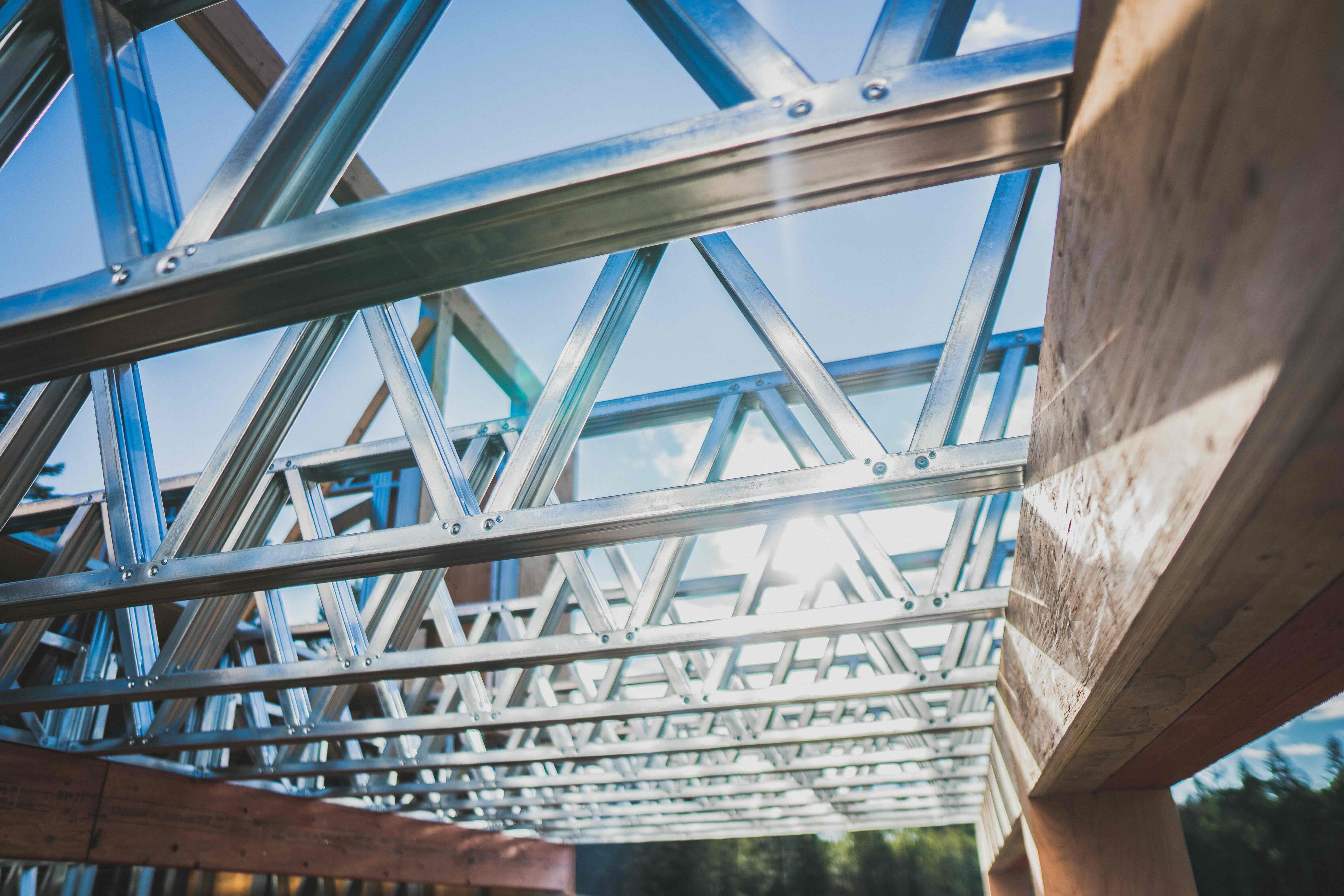 Sun flare through steel trusses with timber framing