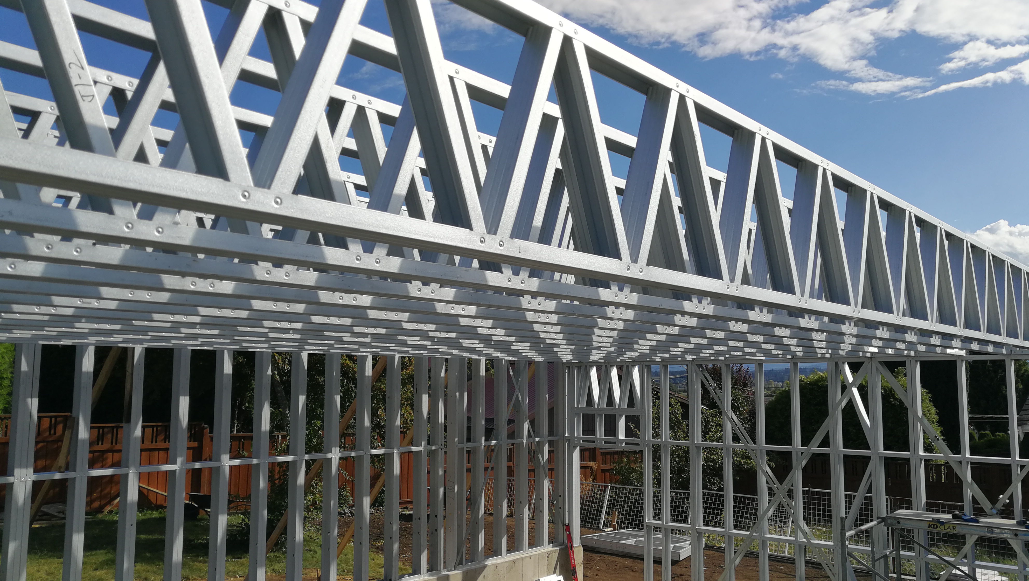 Wide view of steel frame structure against the sky