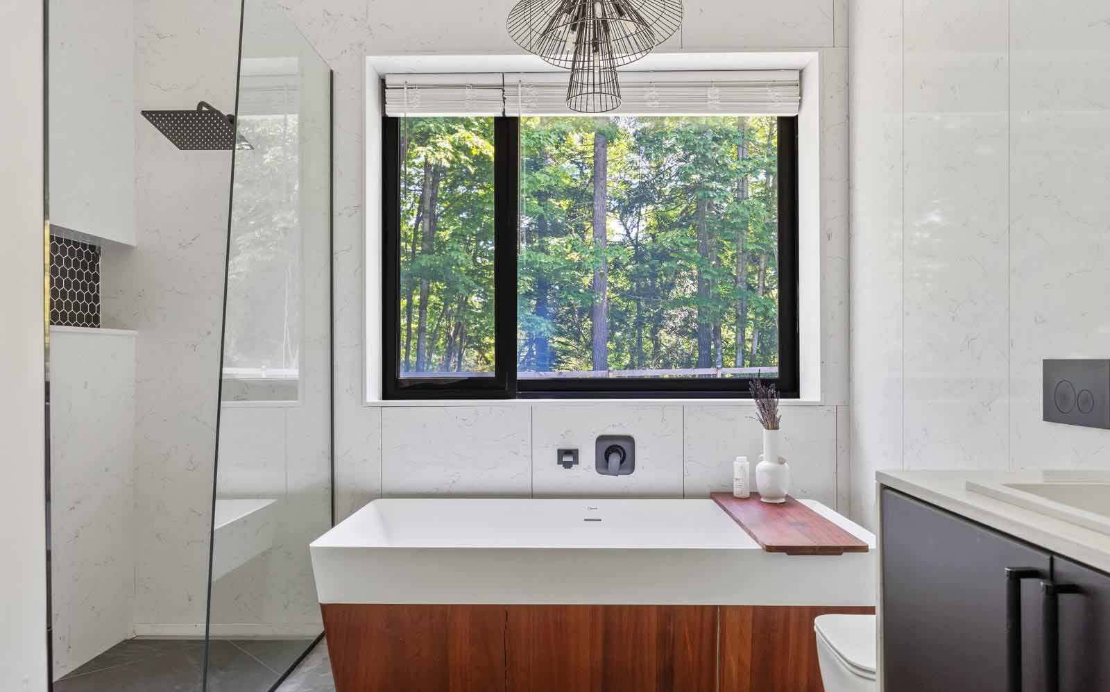 Bathroom with freestanding tub, timber surround and walk-in shower